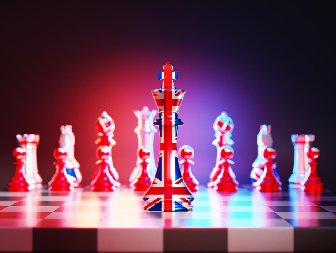 Flag of United Kingdom chess king on a chessboard stock photo