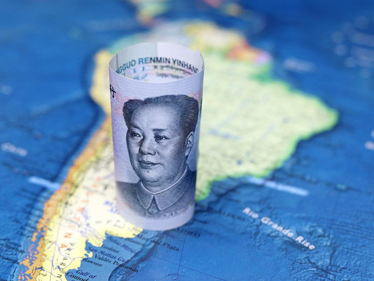 Chinese yuan on the map of South America - stock photo
