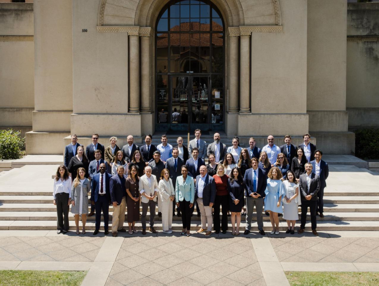 Participants in the 2026 Hoover Institution International Seminar stand with Condoleezza Rice before Hoover Tower on June 23, 2026. (Patrick Beaudouin)