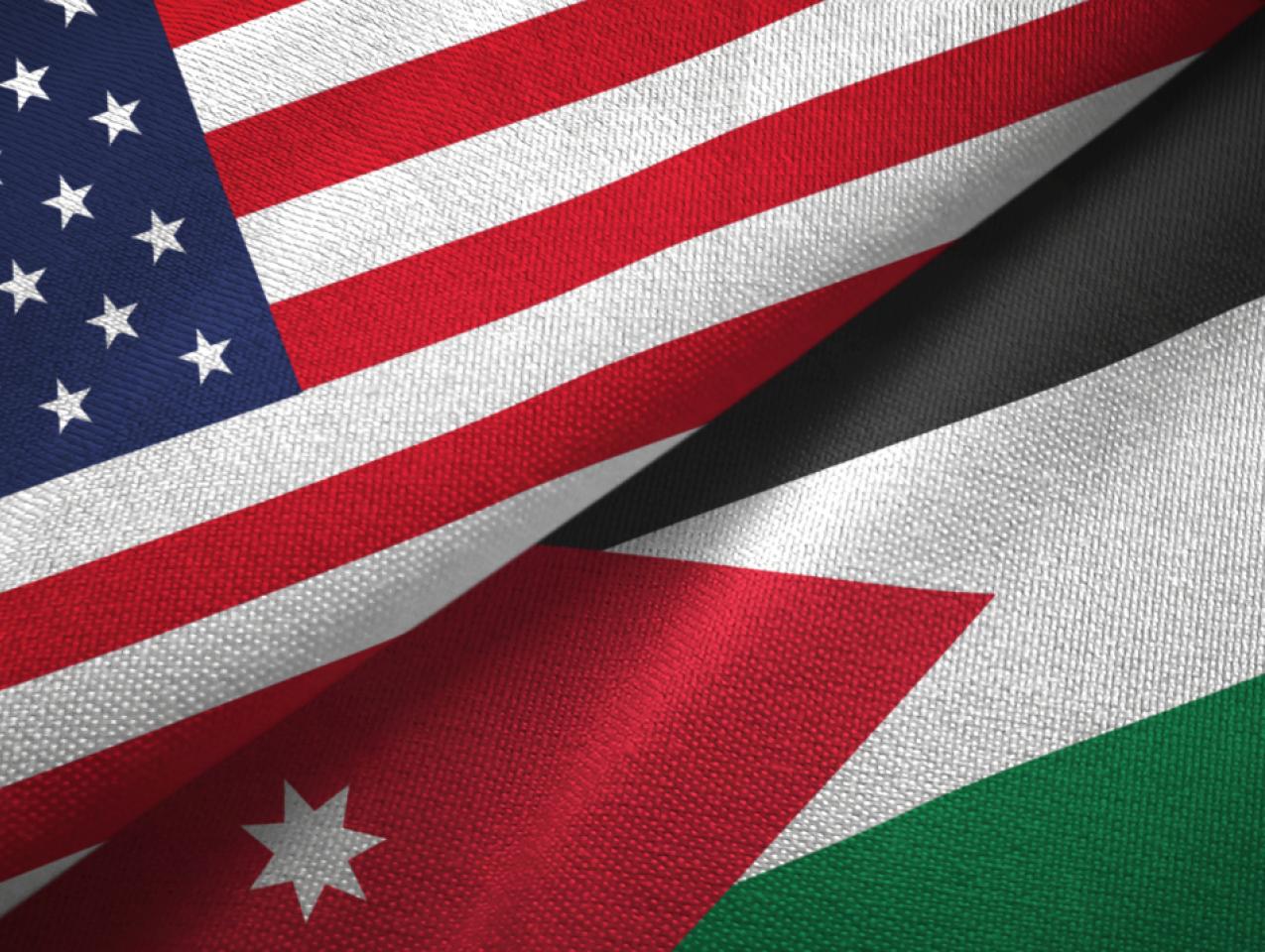 Jordan and United States two flags together textile cloth, fabric texture - stock photo