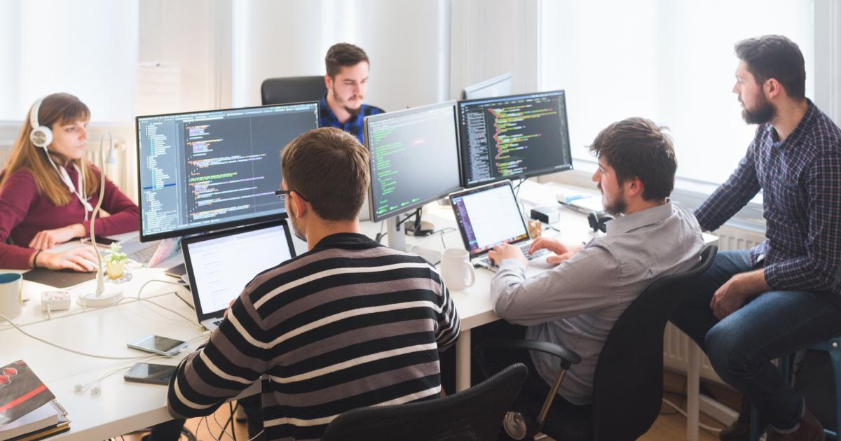 Software developing team working in the office stock photo