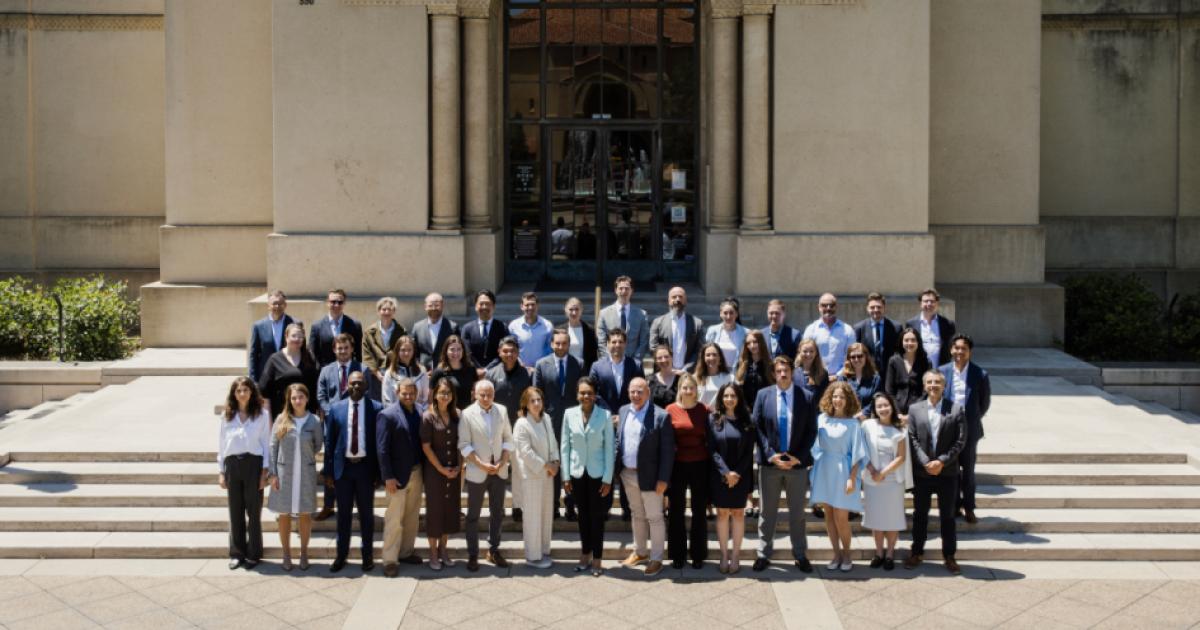 Participants in the 2026 Hoover Institution International Seminar stand with Condoleezza Rice before Hoover Tower on June 23, 2026. (Patrick Beaudouin)