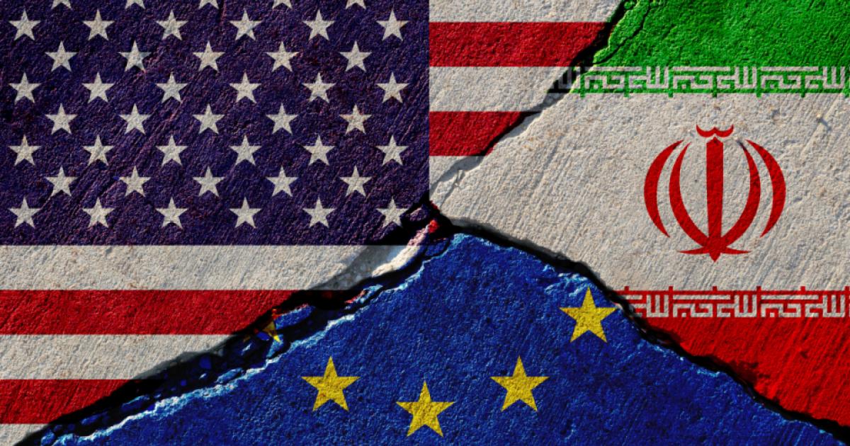 Concrete wall with painted united states, european union and iran flags stock photo