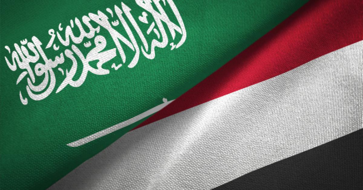 Yemen and Saudi Arabia two flags together textile cloth, fabric texture stock photo